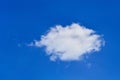 Single small white cloud in the blue sky for background