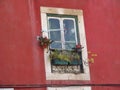 Single small window in a facade, in the old town of Lisbon, Portugal. Royalty Free Stock Photo
