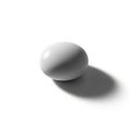 A single, smooth white egg is centered on a stark white background Royalty Free Stock Photo