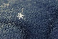 Single snowflake on a wool mitten Royalty Free Stock Photo