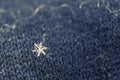 Single snowflake on a wool mitten Royalty Free Stock Photo
