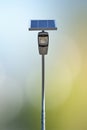 Single solar-powered street lamp with integrated panel and compact LED lantern Royalty Free Stock Photo