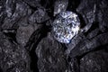 Diamond amongst Coal Royalty Free Stock Photo