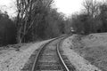 single spooky train tracks leading into the distance in black and white Royalty Free Stock Photo