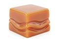 A single square caramel candy with wavy texture Royalty Free Stock Photo
