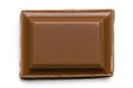 Single square of milk chocolate isolated on white from above