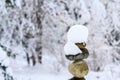 Single stack of snow covered round rocks in a peaceful snowy zen garden Royalty Free Stock Photo