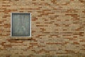 Single stained glass window brick church wall Royalty Free Stock Photo