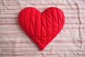 single stitched quilted heart on a cloth