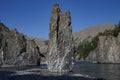 Single stone pillar in the riverbed. Royalty Free Stock Photo