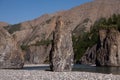 Single stone pillar in the riverbed. Royalty Free Stock Photo