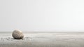 Abstract Endurance Background Featuring a Single Stone on a Gray Surface in a Minimalistic Setting With Focus on Royalty Free Stock Photo