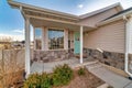 Single storey house with open porch bay window and pastel green front door Royalty Free Stock Photo