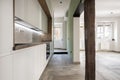 Single story kitchen with oak-topped white wood cabinets,