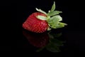 A single strawberry isolated on black Royalty Free Stock Photo
