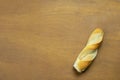 Single stripped bread on wooden table