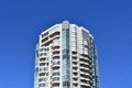 Single tall skyscaper building in a blue sky on Robson Street, Downtown Vancouver, Canada Royalty Free Stock Photo