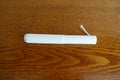 Single tampon with cardboard applicator