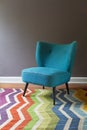 Single teal blue armchair and colorful chevron pattern rug inter