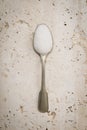 A single teaspoon with white sugar Royalty Free Stock Photo