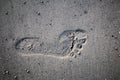 Single textured footprint in sand Royalty Free Stock Photo
