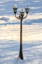 Single three lamp in the snow outside Royalty Free Stock Photo