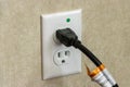 Cord plugged into power outlet