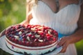 Single tier wedding cake decorated with a variety of berries