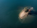 Single tiny island from above in fresh water Lake Wylie