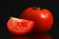 Single tomato isolated on black background Royalty Free Stock Photo