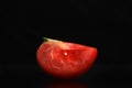 Single tomato isolated on black background Royalty Free Stock Photo
