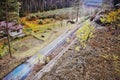 Single track number 080 with train leading mysterious pine forest in Machuv kraj region in czech republic