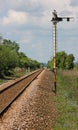 A Single Track Railway Line with Semaphore Signal Royalty Free Stock Photo