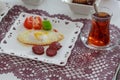 Single turkish breakfast plate with tea.