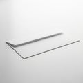 A Single White Envelope Lying Flat on a White Surface with Subtle Shadows paper stationery Royalty Free Stock Photo