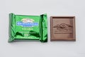 A single unwrapped and wrapped Mint ghirardelli chocolate square