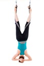 Single upside down woman doing aerial yogawith a hammock