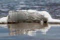 Plastic bottle washed up at beach Royalty Free Stock Photo