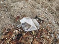 Single use plastic cup in sand, marine trash on the beach.Plastic pollution on the beach.  Stop plastic pollution. Garbage at Royalty Free Stock Photo