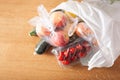 Single use plastic waste issue. fruits and vegetables in plastic bags