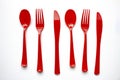 Single use red plastic cutlery on a white background. Concept: Ban single use plastic Royalty Free Stock Photo