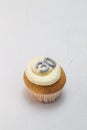 Single vanilla sponge cup cake with silver glitter number 30 on