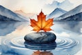 A single vibrant orange maple leaf rests on a smooth stone in calm water with distant mountains Royalty Free Stock Photo
