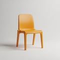 A modern orange plastic chair isolated on white background, perfect for contemporary interior design Royalty Free Stock Photo