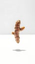 Fresh Turmeric Root Levitating on White Background Royalty Free Stock Photo