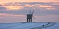 Single walker at Chesterton windmill in winter Royalty Free Stock Photo