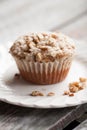 Single walnut crumb sweet potato muffin on table Royalty Free Stock Photo