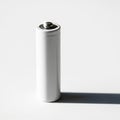 A Single White A Battery Standing Upright on a White Surface with a Strong Shadow aa battery Royalty Free Stock Photo