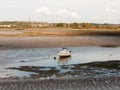 single white boat with mast parked in estuary river stream outside landscape Royalty Free Stock Photo