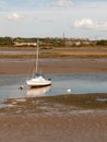 single white boat with mast parked in estuary river stream outside landscape Royalty Free Stock Photo